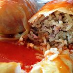 picture of cabbage leaves stuffed with meat, rice and baked