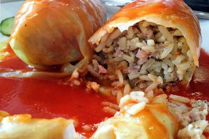 picture of cabbage leaves stuffed with meat, rice and baked