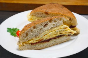 picture of egg, ham and cheese on focaccia bun
