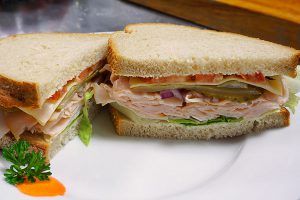 picture of deli sandwich with turkey on rye bread