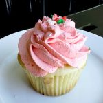 image of cupcake with strawberry cream on top