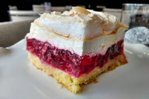 image of raspberry cake made with fresh raspberry, jell-o, whipped mascarpone and almond meringue